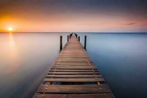 un largo exposición fotografía de un muelle en el océano. generado por ai foto