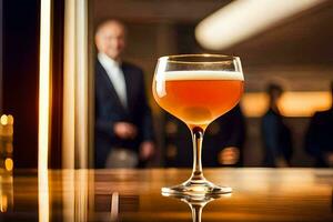 a glass of beer sitting on a table in front of a man. AI-Generated photo