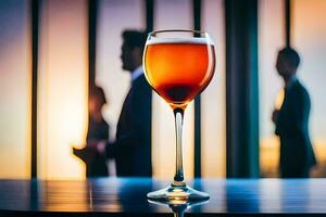 un vaso de vino en un mesa en frente de un grupo de gente. generado por ai foto