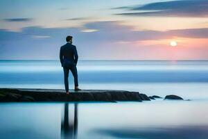 a man in a suit stands on a rock in front of the ocean. AI-Generated photo