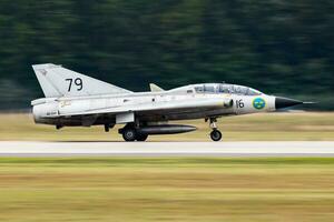 Military fighter jet plane at air base. Air force flight operation. Aviation and aircraft. Air defense. Military industry. Fly and flying. photo