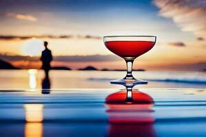 a cocktail glass on the beach at sunset. AI-Generated photo