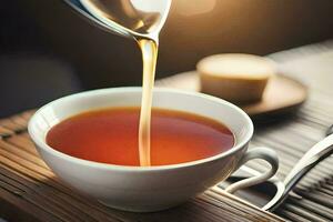 a cup of tea being poured into a bowl. AI-Generated photo