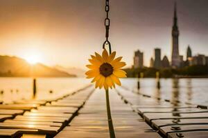 sunflower hanging from a chain in front of a city skyline. AI-Generated photo