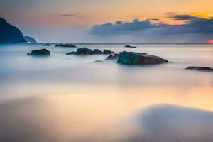 a long exposure photograph of rocks on the beach at sunset. AI-Generated photo