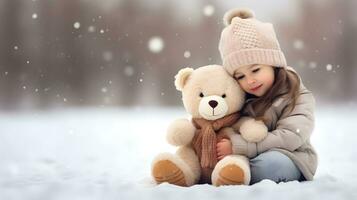 Little girl and toy teddy bear on snow field. Friendship, best friend concept. photo