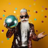 Crazy elderly man holding disco ball and having fun. Celebrating life concept. photo