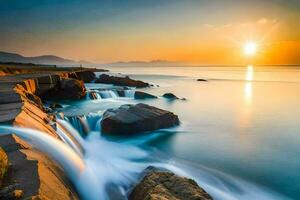 un hermosa puesta de sol terminado el Oceano con rocas y agua. generado por ai foto