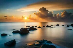 un hermosa puesta de sol terminado el Oceano con rocas y agua. generado por ai foto