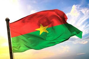 Burkina-Faso 3D rendering flag waving isolated sky and cloud background photo