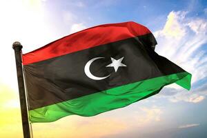 Libya 3D rendering flag waving isolated sky and cloud background photo