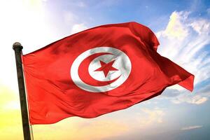 Tunisia 3D rendering flag waving isolated sky and cloud background photo