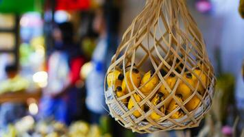 Hanging bananas in the market for sale photo