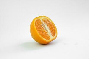 Isolated half a slice of fresh orange fruit on white background with a shadow photo