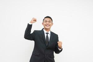 Portrait Young Asian businessman happy with smiling face fist pump hand isolated on white background photo