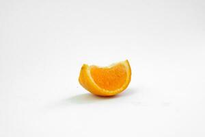 Isolated a slice of fresh orange fruit on white background with a shadow photo