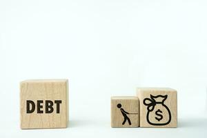 Employee work for money to pay off debts concept, people icon pull money to debt word screen on a wooden cube block shape on white background. Labor Day, September 4 photo