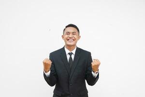 Portrait Young Asian businessman happy with smiling face fist pump hand isolated on white background photo