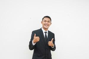 Portrait Young Asian businessman smiling happy face and thumb up, give praise, agree, isolated on white background photo