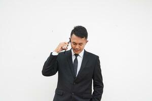 Portrait Young Asian businessman calling use mobile phone, talk about business isolated on white background photo