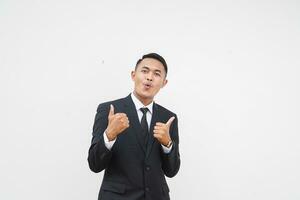 Portrait Young Asian businessman smiling happy face and thumb up, give praise, agree, isolated on white background photo