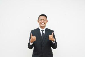 Portrait Young Asian businessman smiling happy face and thumb up, give praise, agree, isolated on white background photo