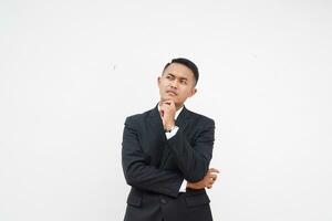 Handsome Asian young businessman thinking a idea with black suit, hand on chin, on white background photo