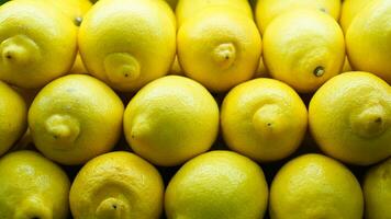 Bunch yellow lemon displayed on supermarket photo