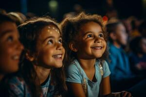 Wide eyed kids in the audience captivated by the magic of live theater unfolding before them photo