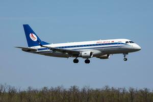 Belavia passenger plane at airport. Schedule flight travel. Aviation and aircraft. Air transport. Global international transportation. Fly and flying. photo