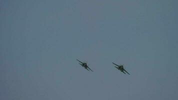 Two military fighter planes in the sky. Jets at an airshow. Military aviation concept video