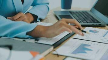 Financial Business team present. Business man hands hold documents with financial statistic stock photo, discussion, and analysis report data the charts and graphs. Finance Financial concept video