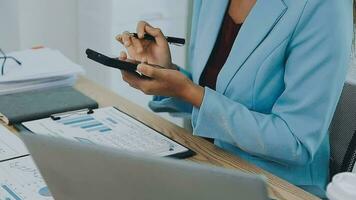 Financial Business team present. Business man hands hold documents with financial statistic stock photo, discussion, and analysis report data the charts and graphs. Finance Financial concept video