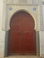 Wooden door with decoration around it photo