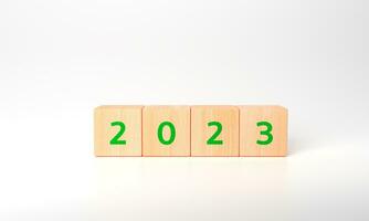 3d rendering of Business plan or Happy new year in 2023 concept for business strategy and development. Minimal wooden cubes green to 2023 text on white background and copy space. Banner new plan. photo