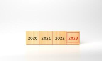 3d representación de 2023 negocio plan y estrategias. meta, plan, acción. anual plan y desarrollo para lograr objetivos. objetivo éxito. de madera cubitos escrito 2023 y plan inteligente foto