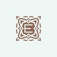 Initial letter E emblem logo. ornamental abstract star pattern frame logo vector