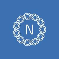 initial letter N ornamental emblem frame circle pattern logo vector
