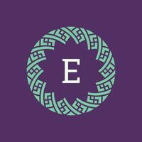 initial letter E ornamental emblem frame circle pattern logo vector