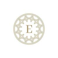 initial letter E ornamental emblem frame circle pattern logo vector