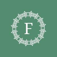 initial letter F ornamental futuristic circle pattern frame emblem logo vector