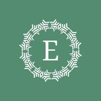 initial letter E ornamental futuristic circle pattern frame emblem logo vector