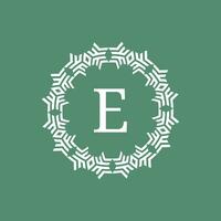 initial letter E ornamental futuristic circle pattern frame emblem logo vector