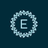 initial letter E ornamental emblem frame circle pattern logo vector