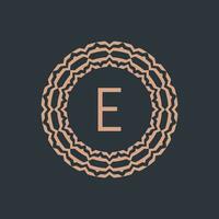 initial letter E ornamental emblem frame circle pattern logo vector