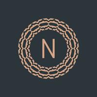 initial letter N ornamental emblem frame circle pattern logo vector