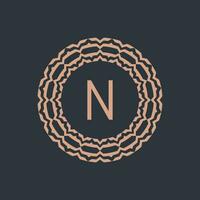 initial letter N ornamental emblem frame circle pattern logo vector