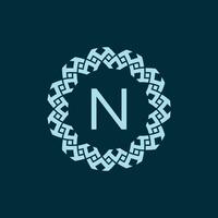 initial letter N ornamental emblem frame circle pattern logo vector