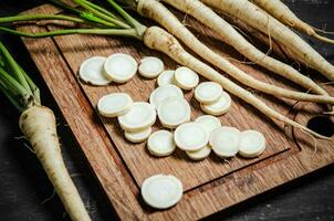 Chopped parsley root. On table photo