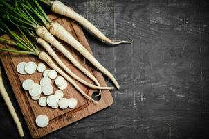 Chopped parsley root. On table photo